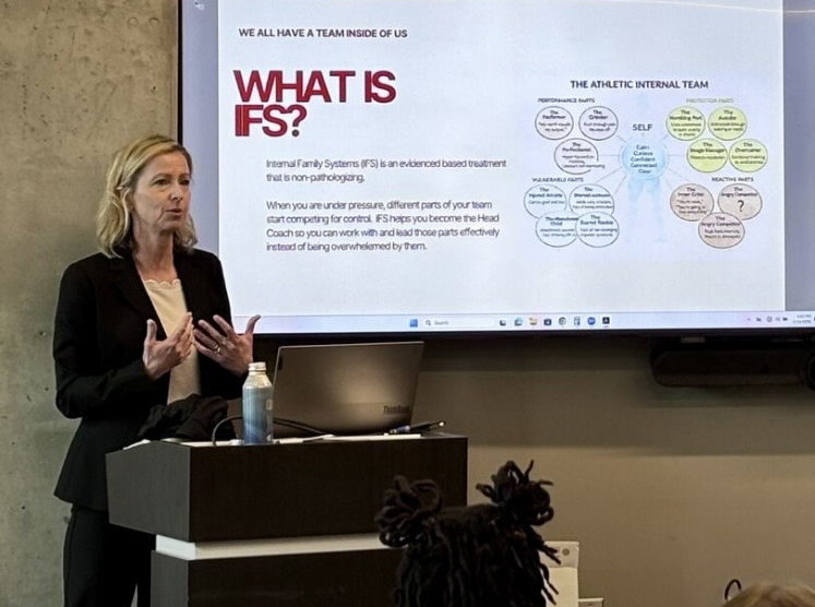 Whitney Dittmar presenting on EMDR and IFS for addiction recovery in athletes and nervous system regulation during a conference