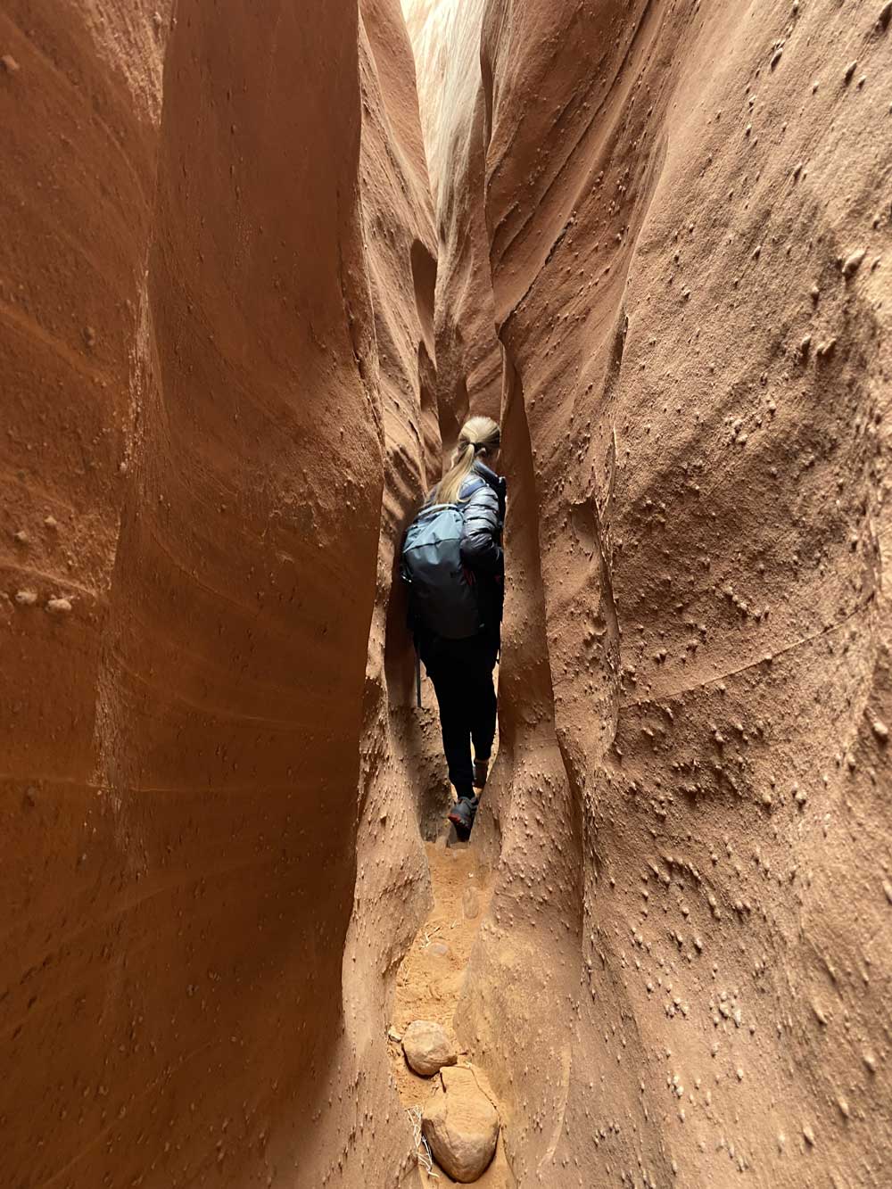 person walking through a narrow canyon representing the healing journey in EMDR therapy